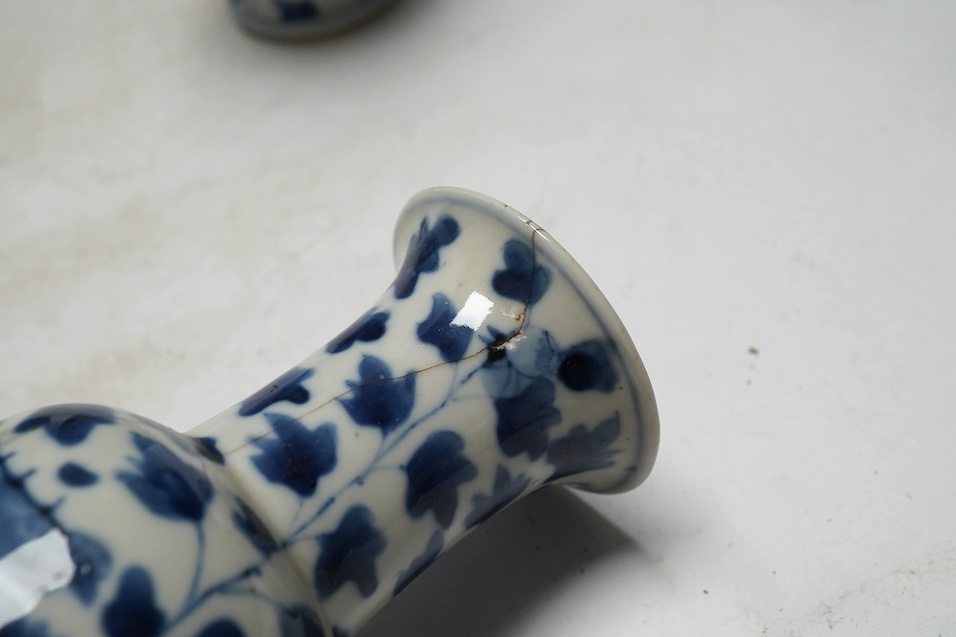 A pair of Chinese blue and white cylindrical brushpots and a smaller pair, tallest 29cm. Condition - both smaller vases with heavy repairs